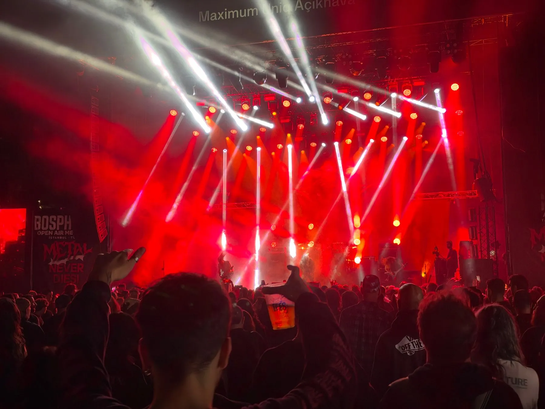 Kataklysm performing amid red and white stage lights